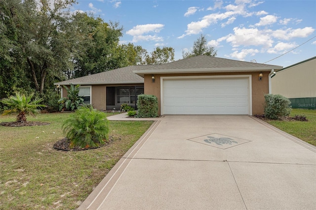 ranch-style house featuring a front yard and a garage