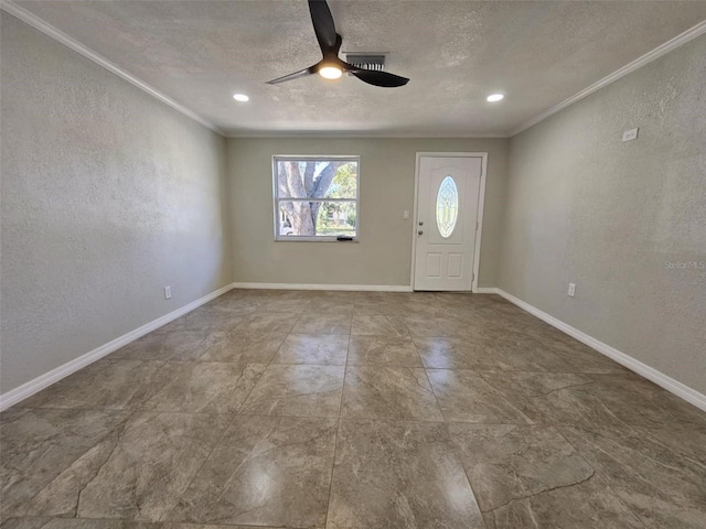 foyer featuring a textured ceiling, ceiling fan, and crown molding