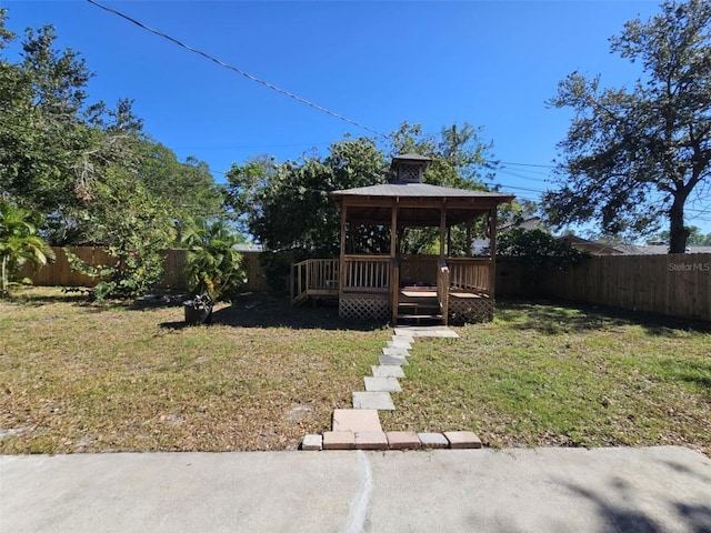 view of yard featuring a gazebo and a deck