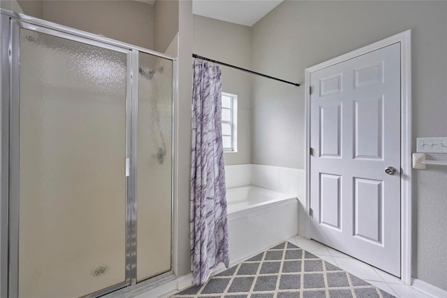 bathroom featuring shower with separate bathtub and tile patterned floors