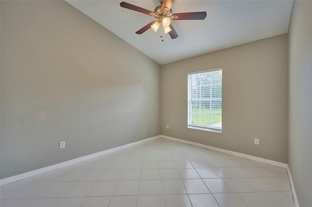 unfurnished room with ceiling fan, light tile patterned flooring, and vaulted ceiling