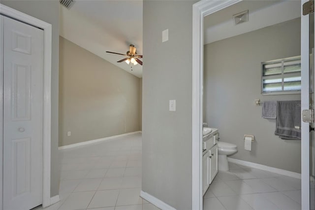 bathroom with tile patterned floors, vanity, ceiling fan, and toilet