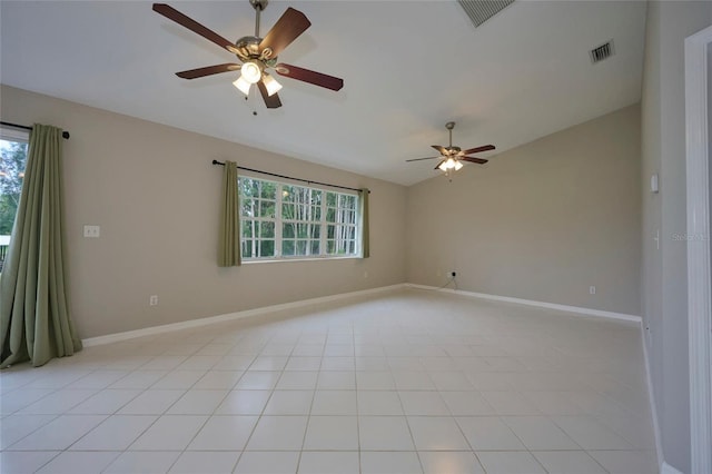 spare room with ceiling fan and lofted ceiling