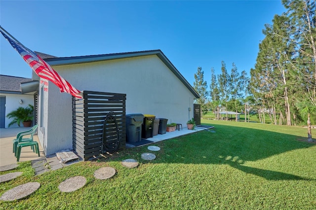 view of home's exterior featuring a yard