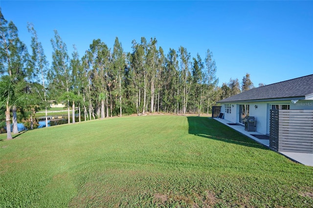 view of yard with a water view