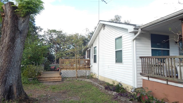 view of home's exterior with a deck