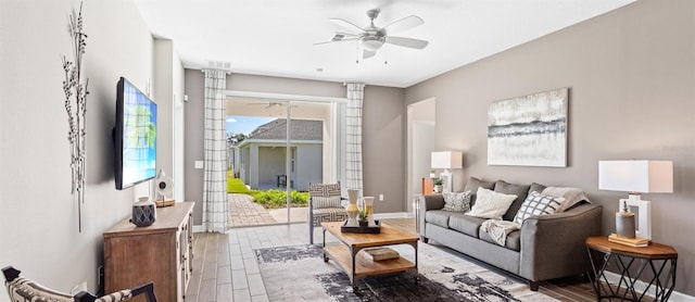 living room with ceiling fan and dark wood-type flooring