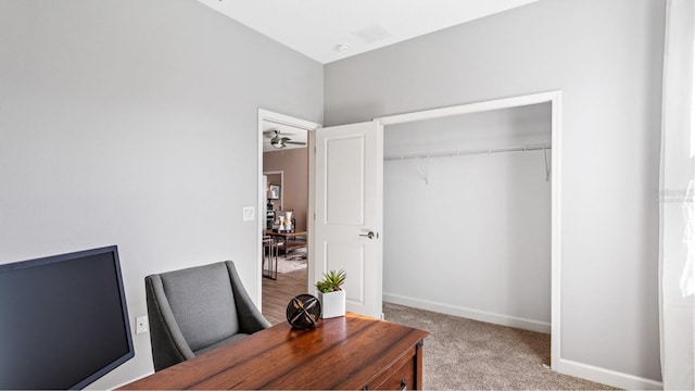 office space featuring ceiling fan and light colored carpet