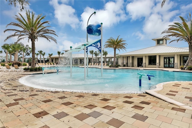 view of pool with pool water feature