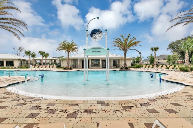 view of swimming pool with a patio