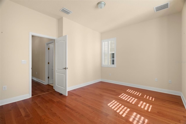 562 Rivercrest Ln, Tarpon Springs, FL 34689 - empty room featuring wood finished floors and baseboards