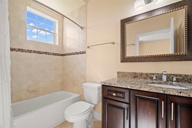 full bathroom featuring tile patterned floors, shower / bath combo with shower curtain, vanity, and toilet