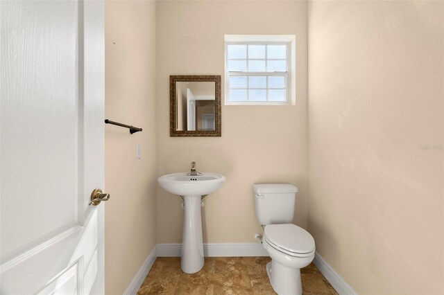 bathroom featuring toilet