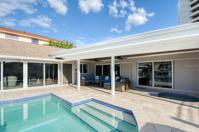 view of swimming pool featuring a patio area, a jacuzzi, ceiling fan, and an outdoor hangout area