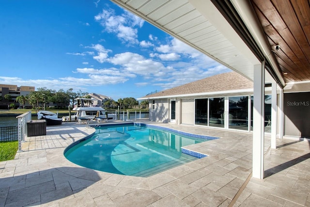 view of swimming pool with a patio