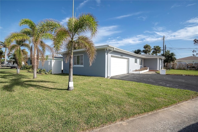 view of front facade featuring a garage and a front yard