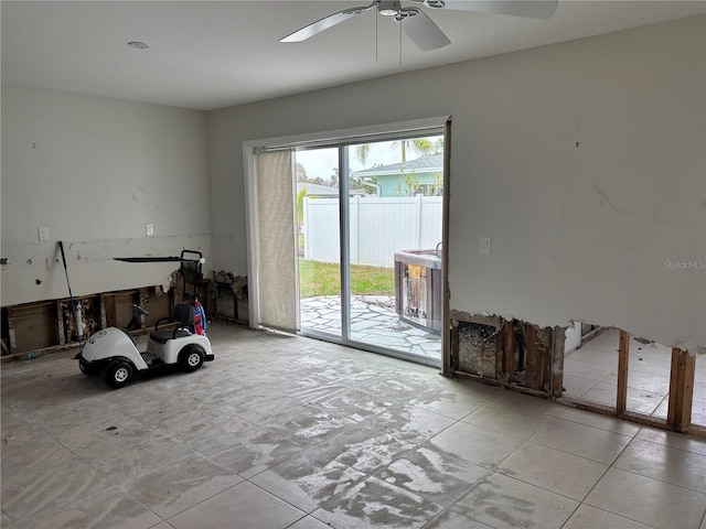 interior space with ceiling fan