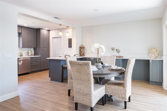 dining area with light wood-type flooring