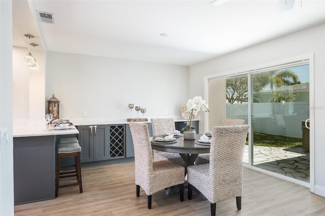 dining space featuring light hardwood / wood-style flooring