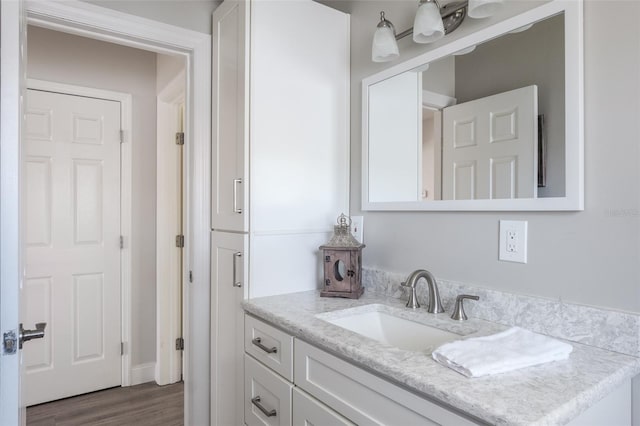 bathroom with vanity and wood-type flooring