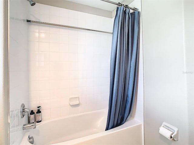 bathroom with shower / bath combination with curtain