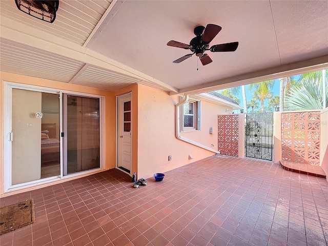 view of patio featuring ceiling fan