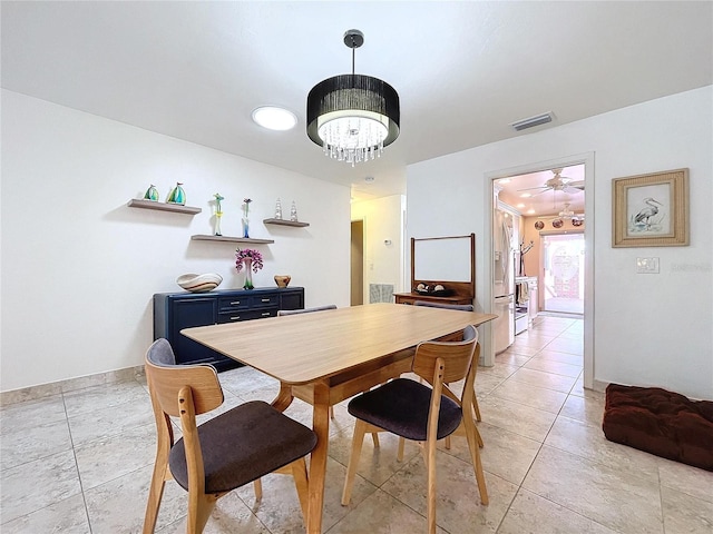 tiled dining room with ceiling fan