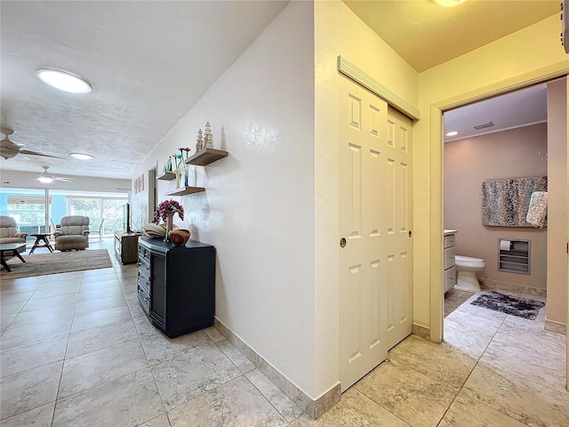 hallway featuring light tile patterned floors