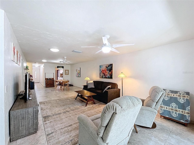 living room featuring ceiling fan