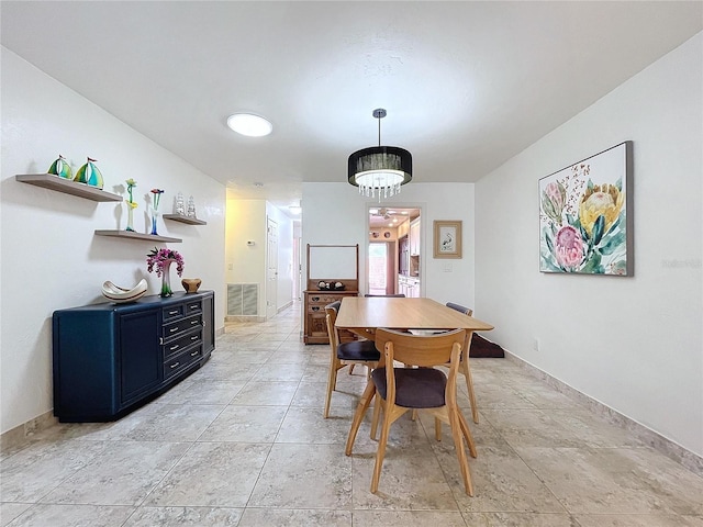 dining room featuring an inviting chandelier