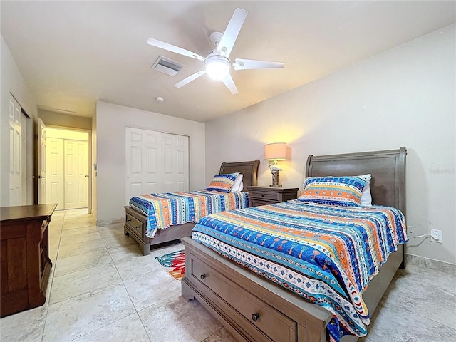 bedroom featuring ceiling fan and a closet