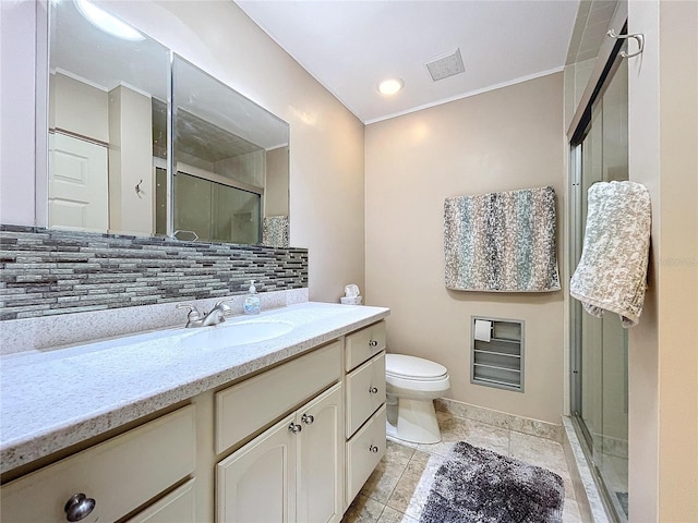 bathroom featuring decorative backsplash, crown molding, vanity, and an enclosed shower