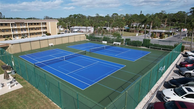 view of tennis court with basketball court