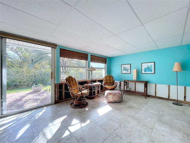 sitting room with a paneled ceiling