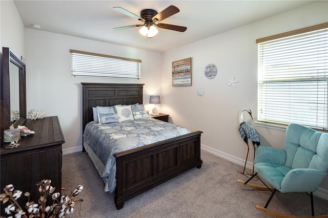 2436 Chateau Loop, Kissimmee, FL 34741 - bedroom featuring multiple windows, carpet flooring, baseboards, and ceiling fan