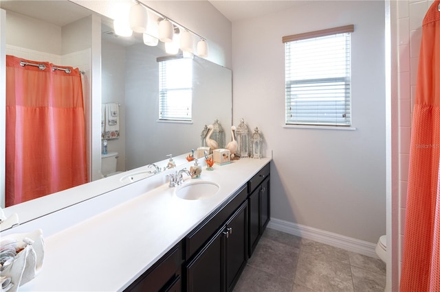 2436 Chateau Loop, Kissimmee, FL 34741 - full bath with toilet, vanity, baseboards, a shower with curtain, and tile patterned floors