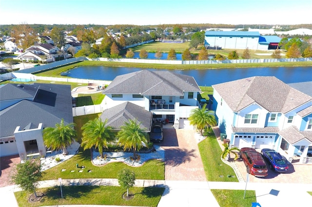 birds eye view of property with a water view