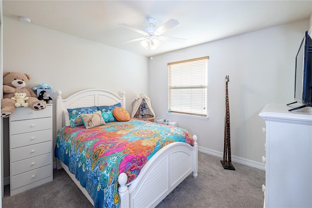 bedroom featuring dark colored carpet and ceiling fan