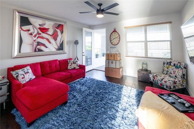 living room featuring dark hardwood / wood-style floors and ceiling fan