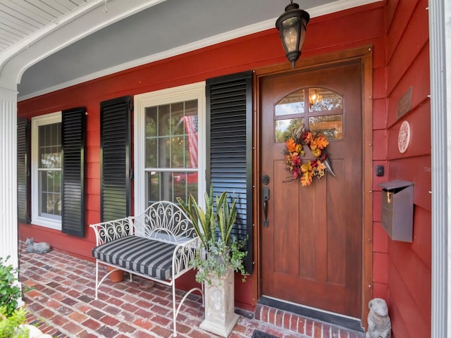 entrance to property featuring a porch