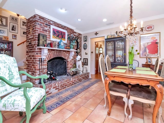 dining room featuring tile patterned floors, crown molding, a fireplace, and a chandelier