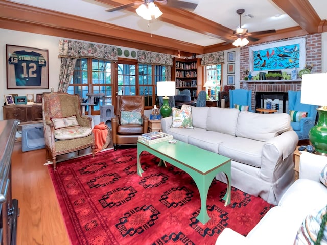 living room featuring beam ceiling, ceiling fan, and hardwood / wood-style floors