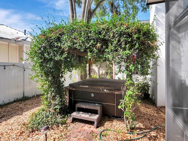 view of yard with a hot tub