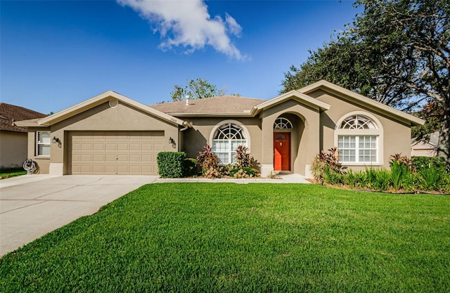 ranch-style home featuring a garage and a front lawn