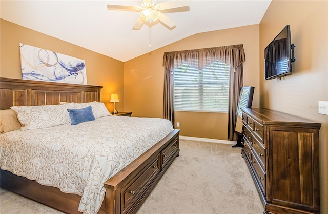 carpeted bedroom with vaulted ceiling and ceiling fan