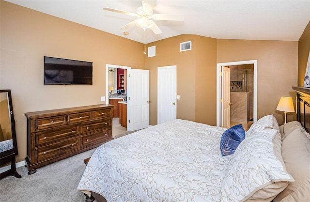 carpeted bedroom featuring ensuite bathroom, a closet, ceiling fan, and lofted ceiling