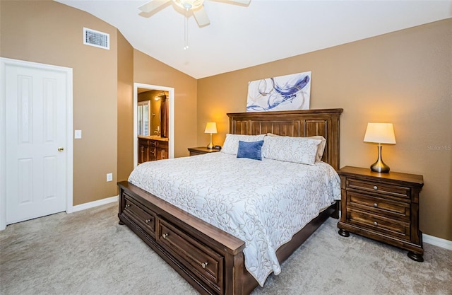 bedroom featuring light carpet, connected bathroom, ceiling fan, and lofted ceiling