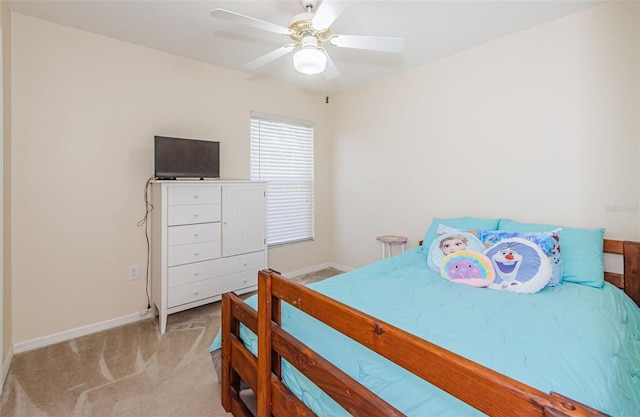 bedroom featuring ceiling fan and light colored carpet