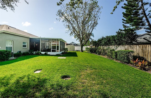 view of yard with a sunroom