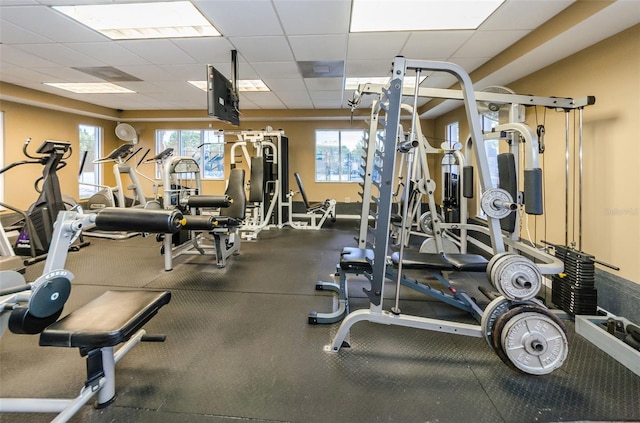 workout area featuring a paneled ceiling